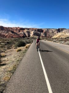 biking up the hill in snow canyon state park utah